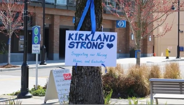 Sign hanging on tree with text: Kirkland Strong Supporting our Nursing Homes and Each other