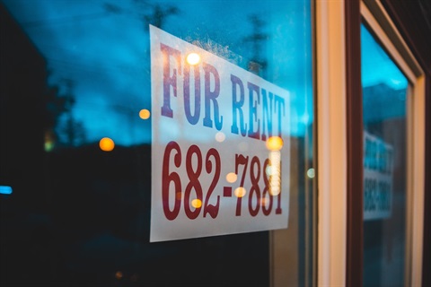 Window with for rent sign