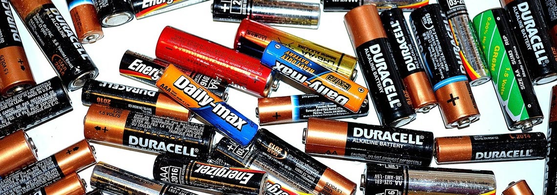 batteries spread over white surface