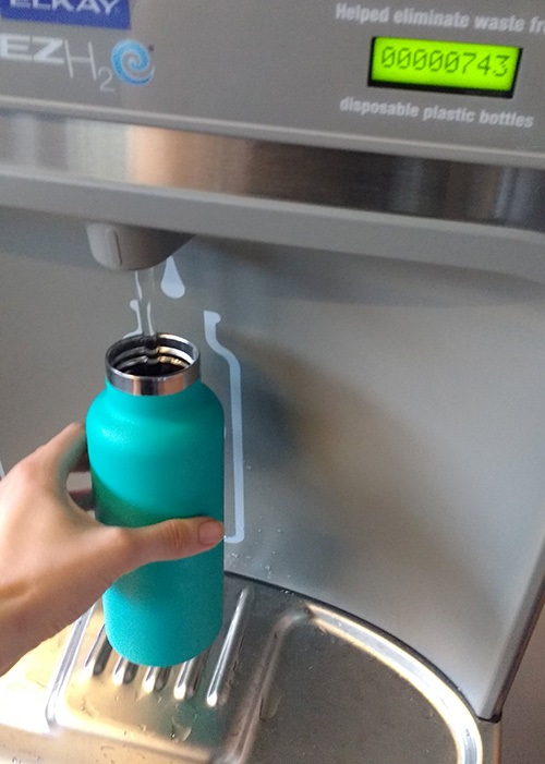 refilling reusable water bottle at City Hall fountain bottle filling station