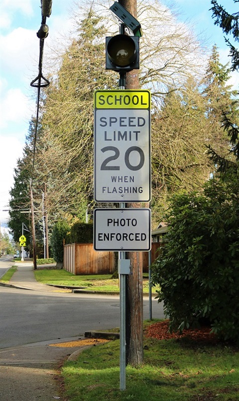 Speed Limit 20 when flashing sign with photo cameras on N.E. 80th Street in Kirkland
