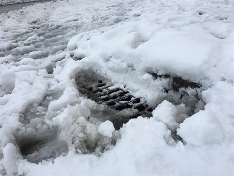 Storm drain blocked by snow