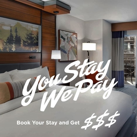 Hotel Room with text: You Stay We Pay