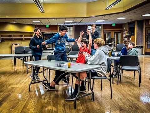 Teens celebrating at a game night