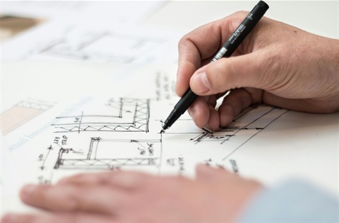 A hand drawing construction plans.