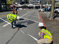 Striping nine parking spots on Lake Street, near Central Way