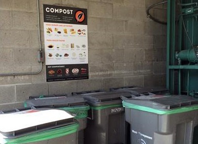 compost carts with large compost poster at commercial property
