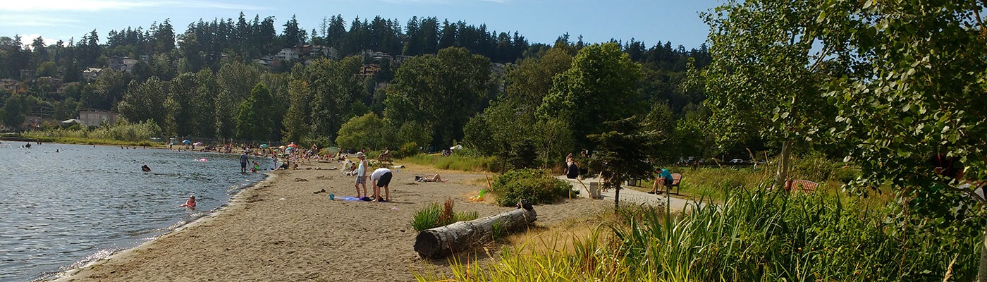 Juanita Beach Park natural shoreline with people having fun