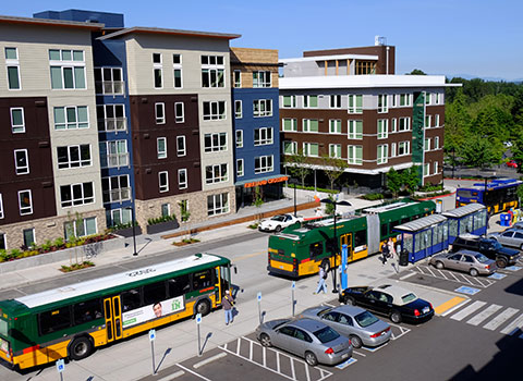 mixed use buildings with busses