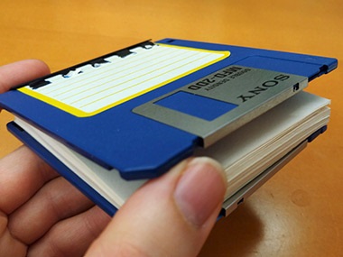 floppy discs were upcycled as the cover for a mini notepad instead of being thrown away