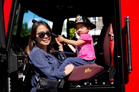 Mother and daughter inside a firetruck
