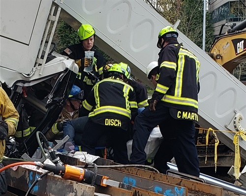 firefighters at crane accident