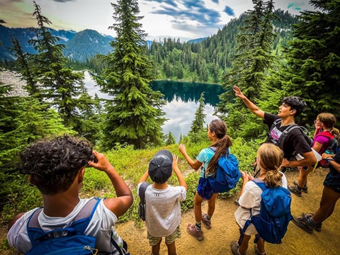 Teens on an outdoor adventure at a lake