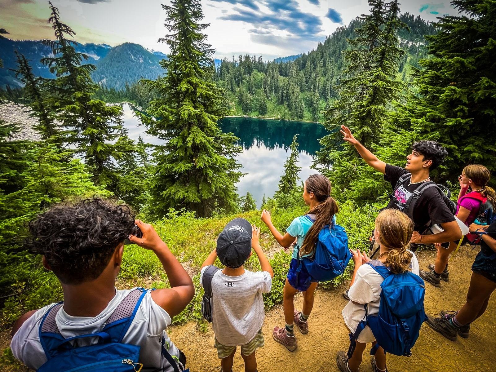 Teens on an outdoor adventure at a lake