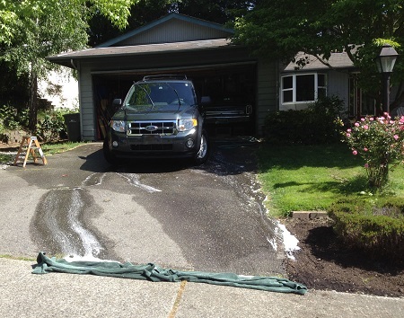 Towels in a driveway.